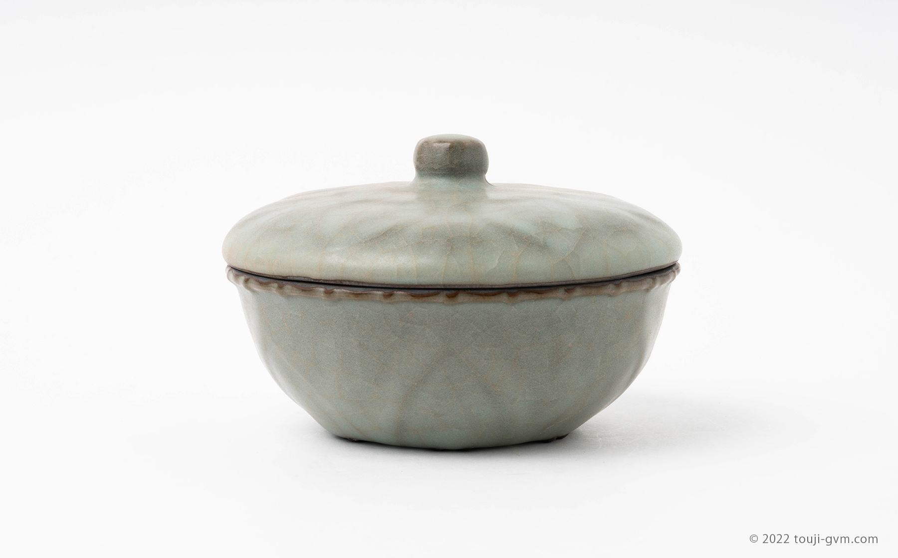 Guan ware Celadon Pot and  Cover with Carved Lotus Design
